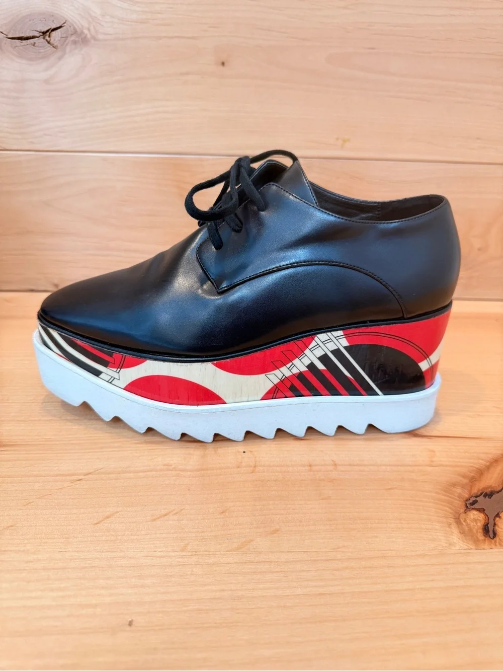 Stella McCartney Black Leather Elyse Platform Shoes with abstract design.
